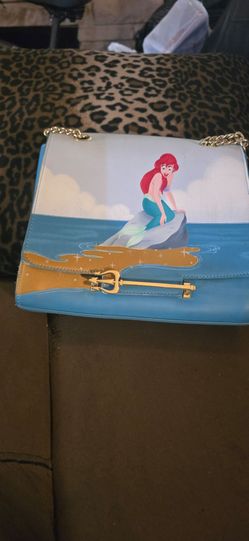 This is a Loungefly Disney Little Mermaid Triton's Gift Crossbody Bag