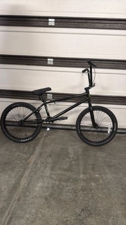 black Redline BMX bike with green accents.