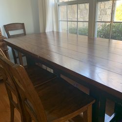 Wooden Formal DInning Table With 8 Chairs and Extension Plate. 