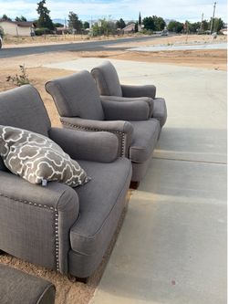 Set of three gray arm chairs