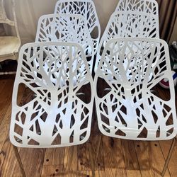 six (6) used good condition White plastic dining office Chairs 