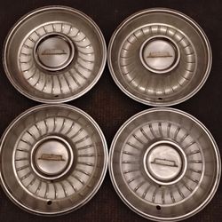 Vintage 1961 Cadillac hub caps