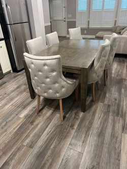 Beautiful dining room table with upholstered chairs