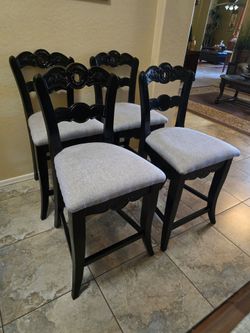 Four ornate Powell Hills counter stools