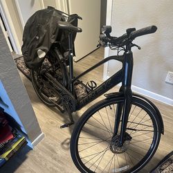 Trek FX+2 Stagger electric bike with two saddle bags