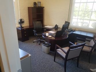 Office set a big brown desk two chairs
