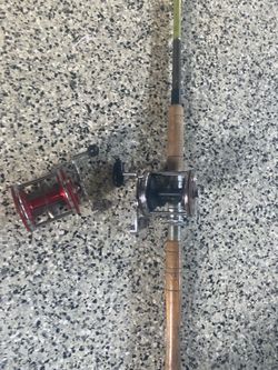 2 Penn jigmaster 500 and rod with tackle box