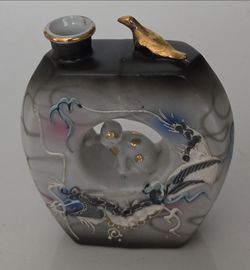 Vintage Japanese Kutani hand painted Moriage dragonware bottle vase, 8 inches tall, 4 inches wide, 1.5 inches deep. Cutout design with rabbit inside, 