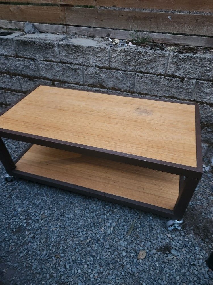 Industrial commercial rolling stand coffee table metal frame bamboo
This is a cool industrial or institutional style table with wheels