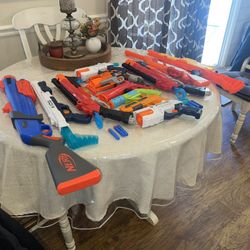 12 ASSORTED NERFSTYLE GUNS ALL WORKING NO BULLETS. RIFLES AND HAND GUNS. SELL AS A LOT NOT SEPARATE.