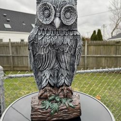 Owl Statue Sitting On A Branch
