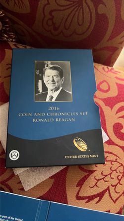 This is the official 2016 U.S. Mint Ronald Reagan Coin & Chronicles Set. It appears complete and includes: