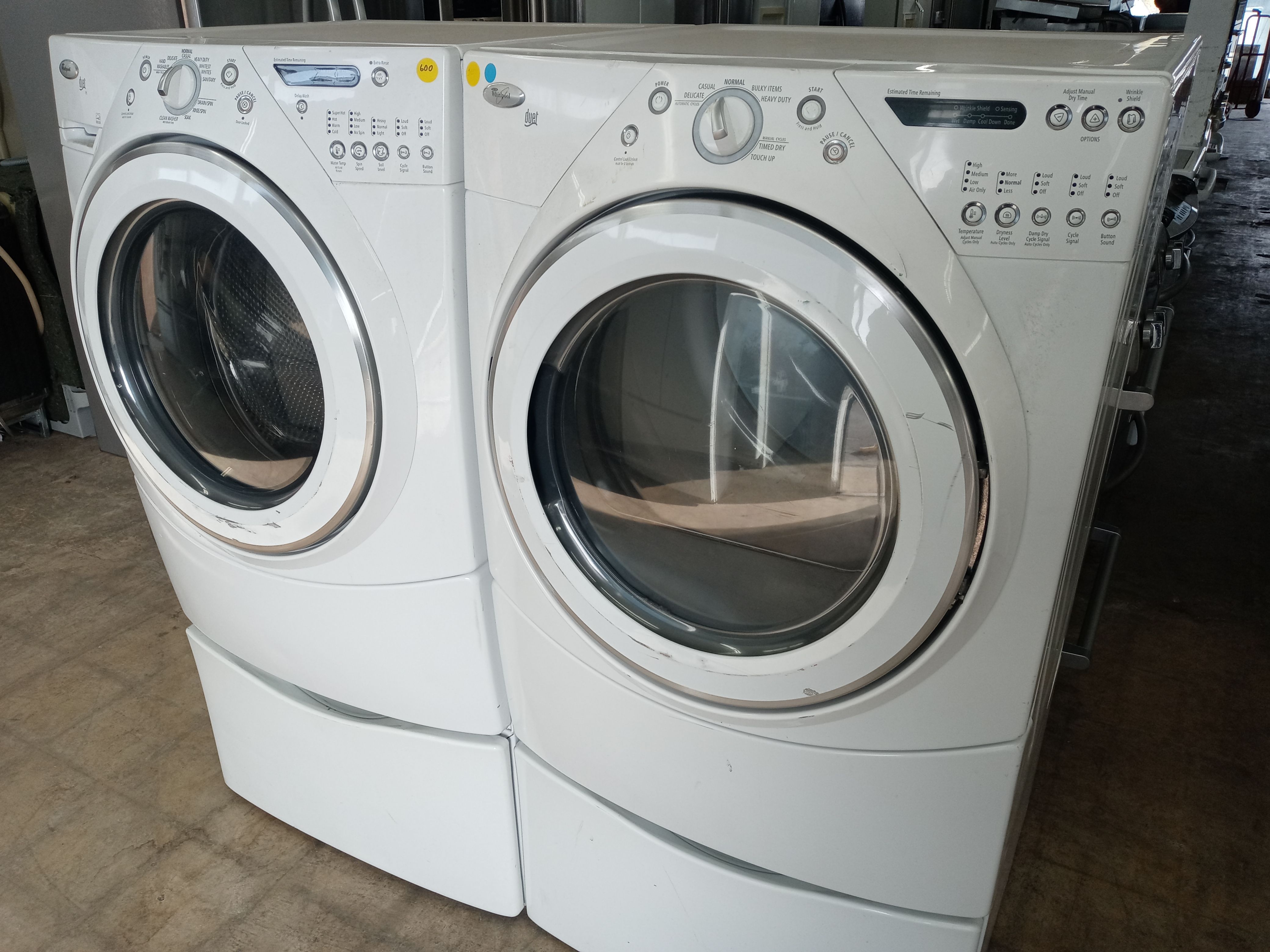 Whirlpool Duet front load washer and dryer set on pedestals - Free delivery