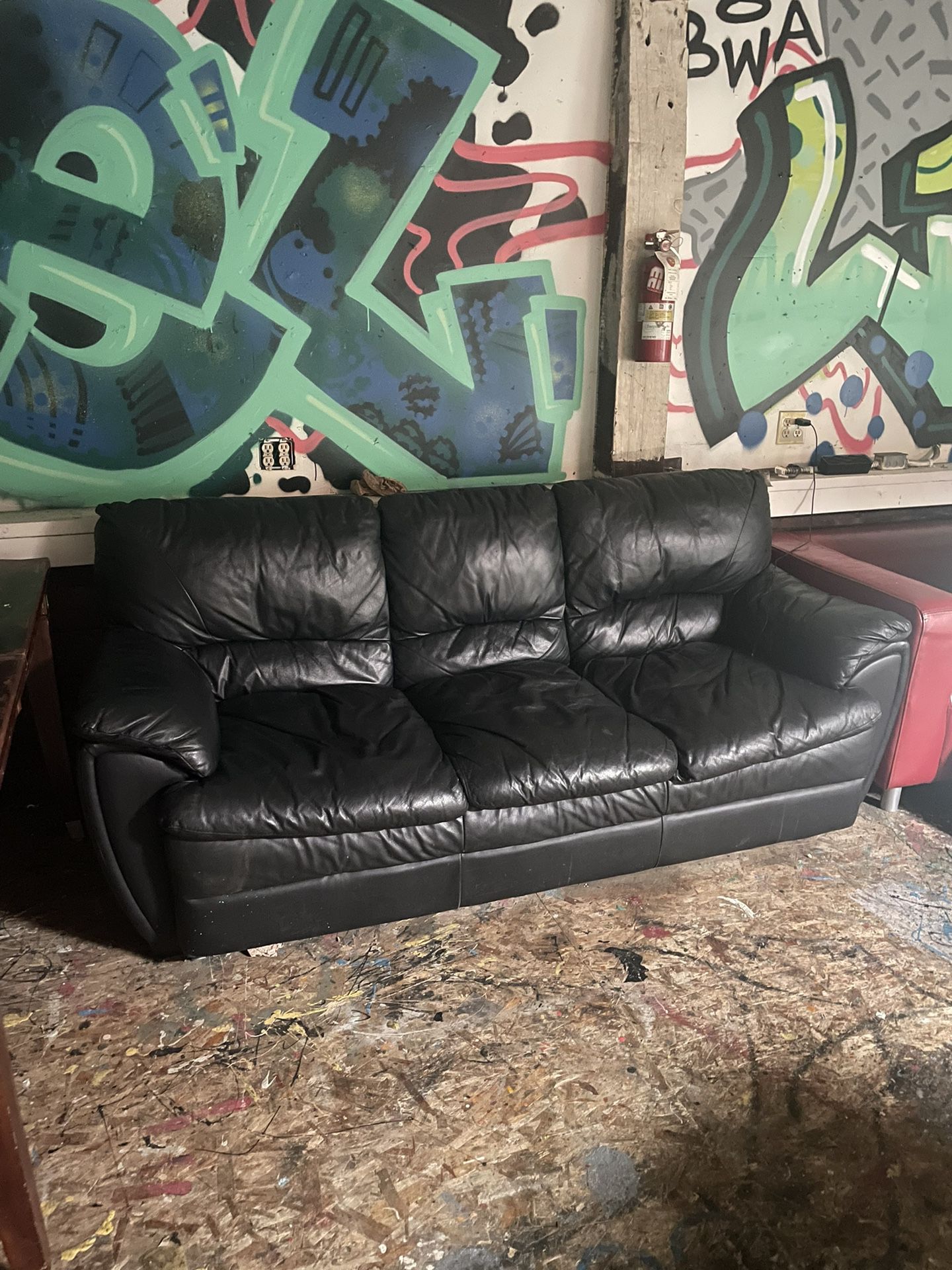 Black leather couch 3 seats 6ft 9in