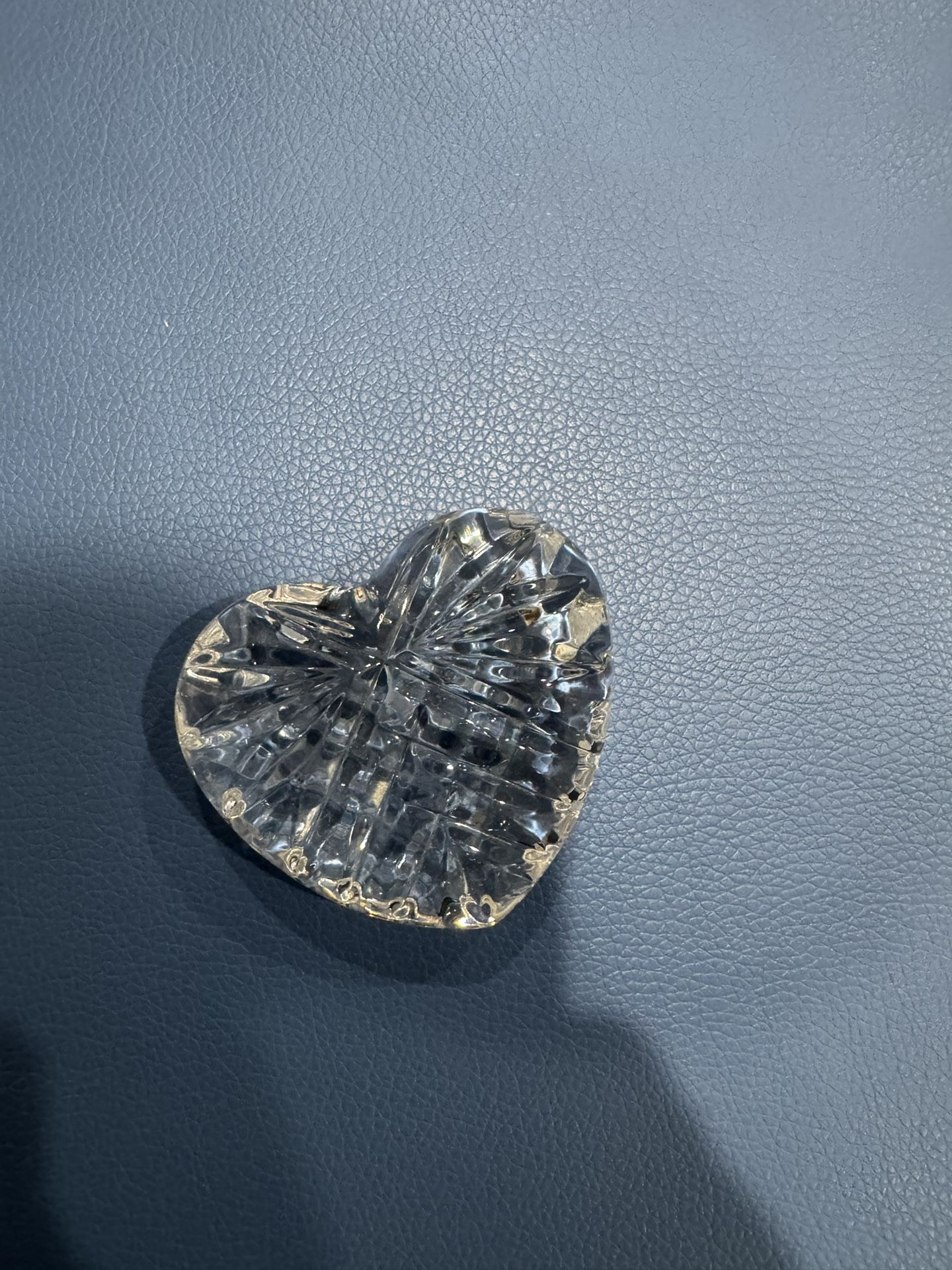 Elegant crystal heart-shaped paperweight.