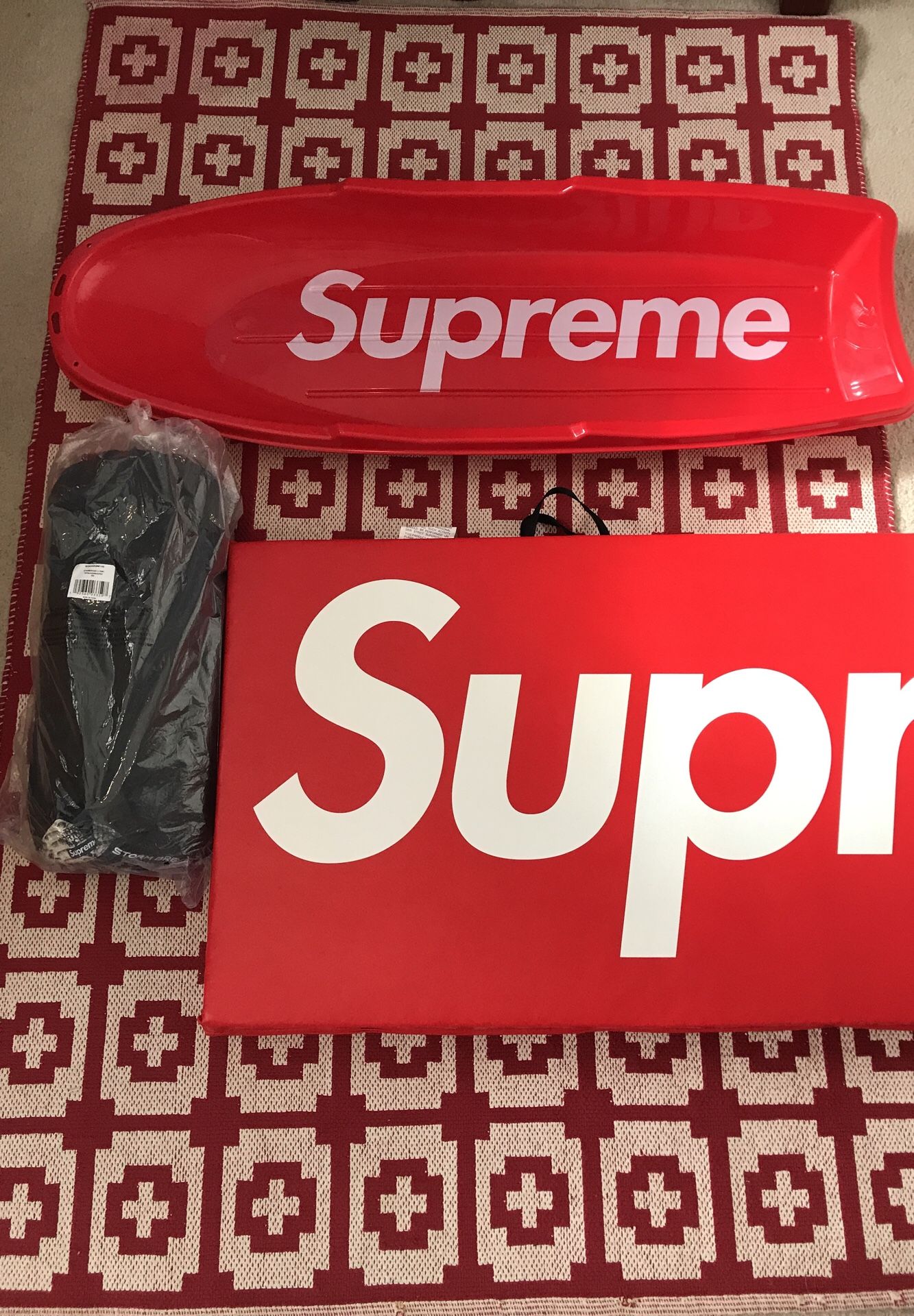 Supreme North Face sled, exercise is yoga mat, and storm break 3 tent