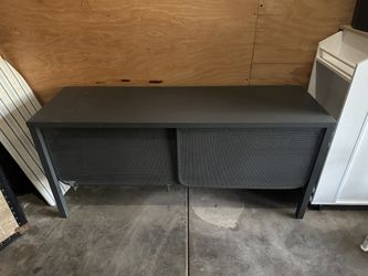 Metal table with shelves and sliding doors