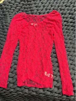 Sheer floral lace long-sleeve top.