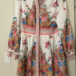 Used Floral dress, size L with a white base.