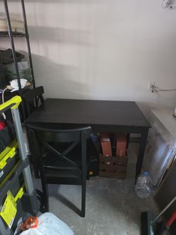 It's a black table with four chairs