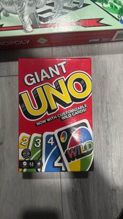The deck contains 108 oversized cards and a rules sheet. It features standard number/action cards along with 4 Customizable Wild Cards where players c