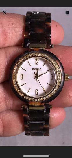 relic watch women, White Face Gold Dial,32 mm Case, Crystal Bezel Tortoise Band. Condition is Pre-owned with normal signs of use . See photos and as