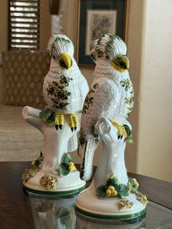 These are mid-century Italian porcelain cockatoo figurines, hand-painted. Green and yellow.