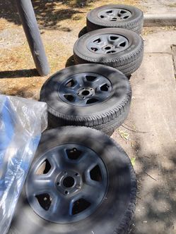 P255 75 R17 tires and rims. Four in total.