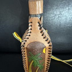 Vintage Hand-tooled, leather-covered glass decanter bottle from Cartagena, Colombia.