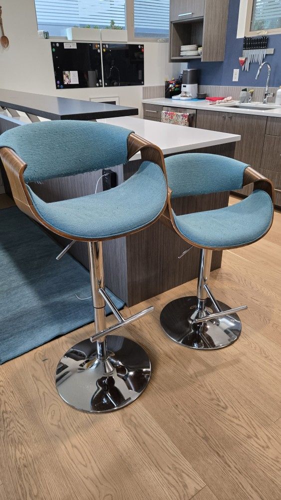 Two Adjustable Height Teal Swivel Bar Stools