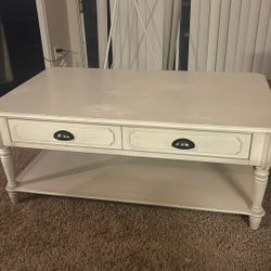 Pier 1 - white wooden coffee table with a farmhouse or cottage-style design