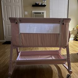 pink bedside bassinet 