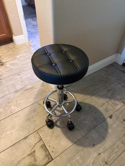 Black salon or massage stool