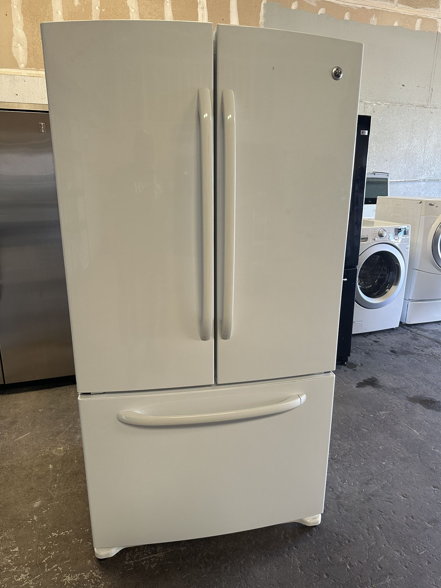 Shiny White GE Frenchdoor with icemaker can deliver  NOTE: crack on freezer door handle does not affect the structure of the handle. It’s just cosmeti
