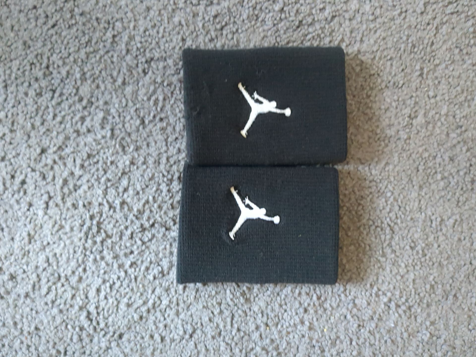 Two Jordan arm bands