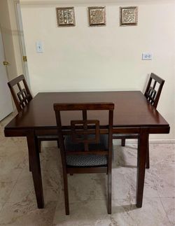 Ashley furniture’s dining table for 4 with 4 chairs