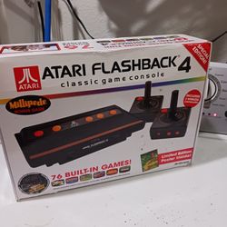 ATARI FLASHBACK 4  Classic game controller.   Good Condition.   76 built in games.  includes 2 wireless controllers. 