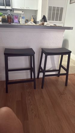 Two black barstools