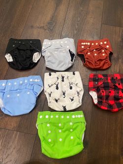 Lot of 7 baby disposable diapers