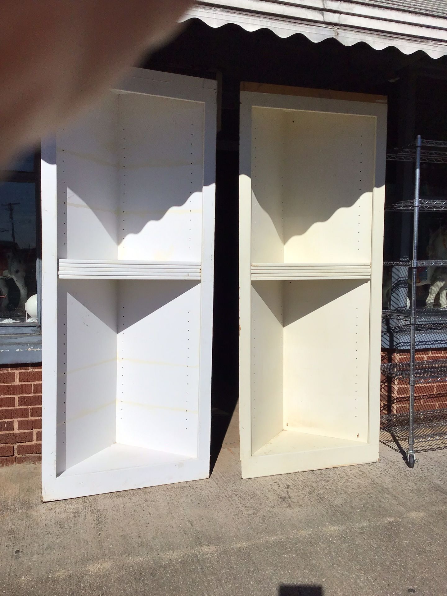 Two corner cupboards...