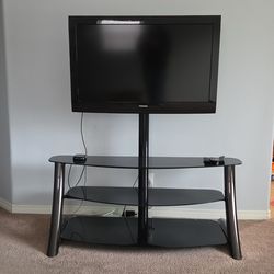 Toshiba 40 inch TV with black glass stand