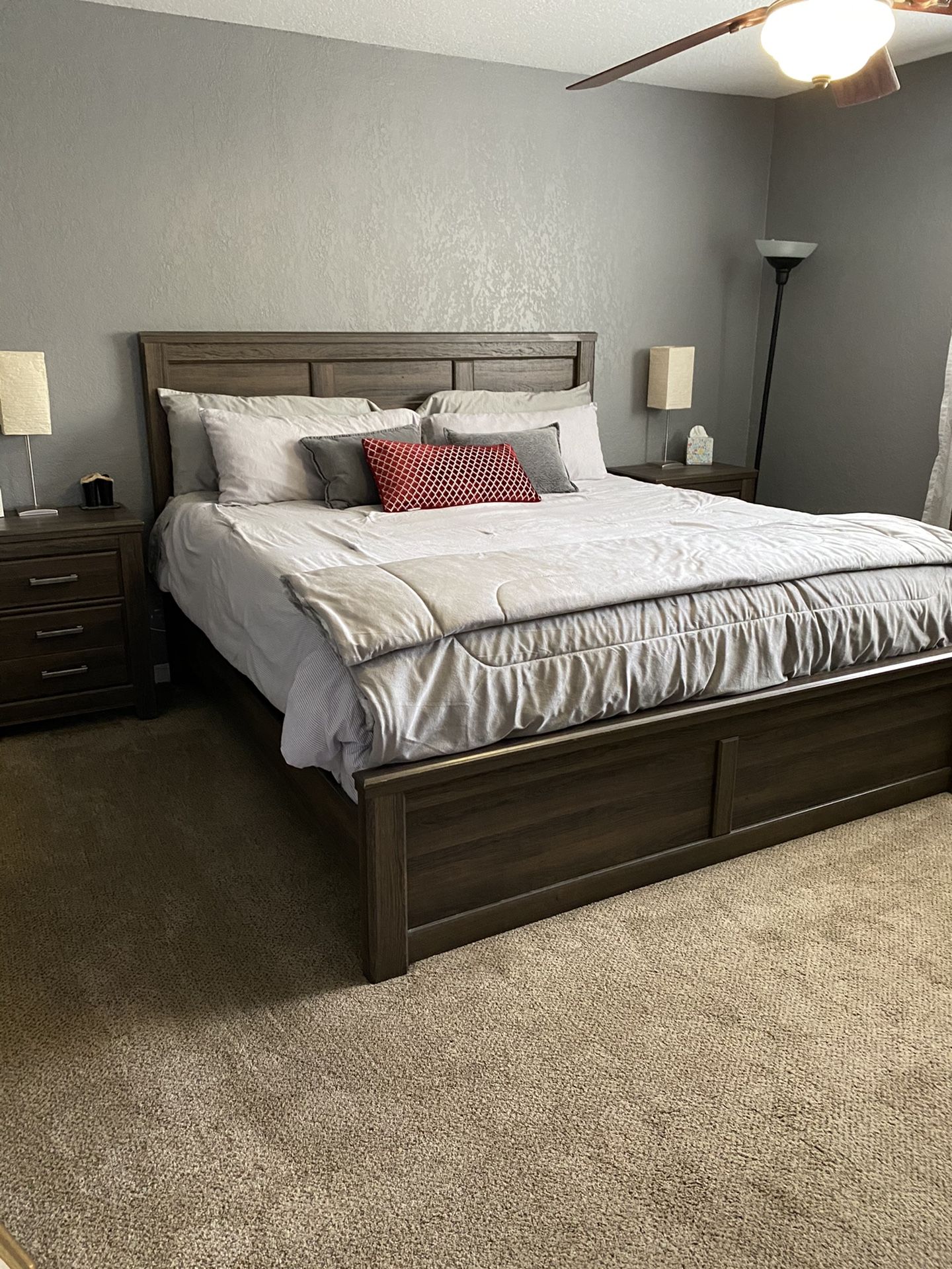 Eastern King sized bed frame with two bedside tables