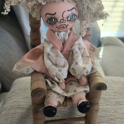 Doll Sitting On Chair 