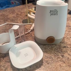 The First Years Baby Bottle Warmer and Sterilizer - Pacifier and Bottle Nipple Sanitizer.