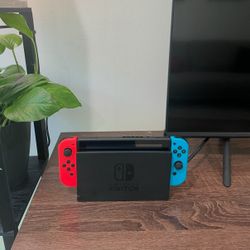 Nintendo Switch (includes 5 Games & 4 Controllers)
