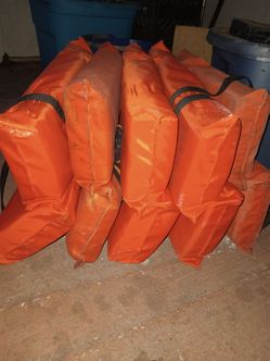 Five adult life jackets for boating.
