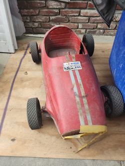vintage pressed steel pedal car, similar to 1960s Giordani Maserati or Morellet Guerineau Ferrari models.