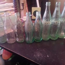 8 Coca Cola Vintage Bottles