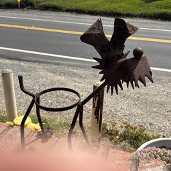And crafted welded dog sculpture/planter