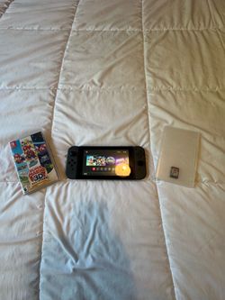 230$$ NINTENDO SWITCH WITH TWO GAMES(FREE DELIVERY)